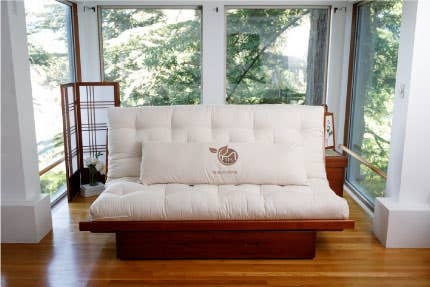 Tufted Cream Futon Loveseat on Platform Base for Zen Sunroom