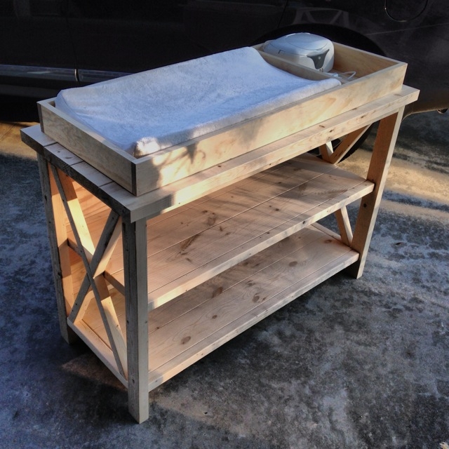 Unfinished X frame changing table with three tier open shelving