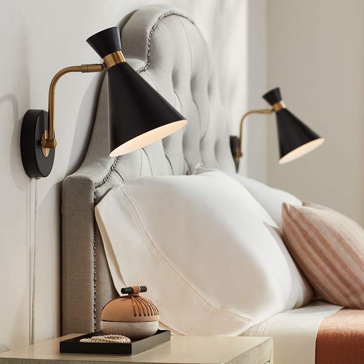 Wall Sconce with Matte Black Cone Shade, Brass Accents, and Swing Arm