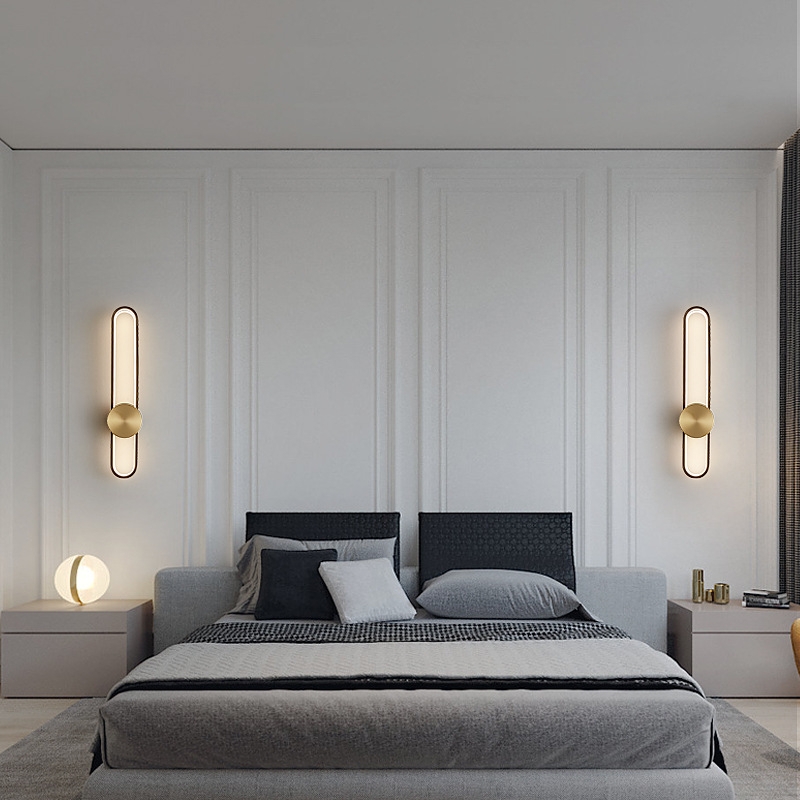 Wall Sconce with Pill Shaped Silhouette and Gold Disc Accent