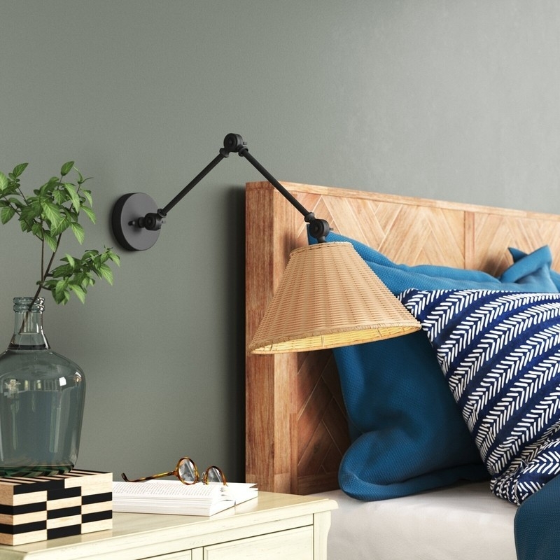 Wall Sconce with Rattan Conical Shade and Articulating Black Arm
