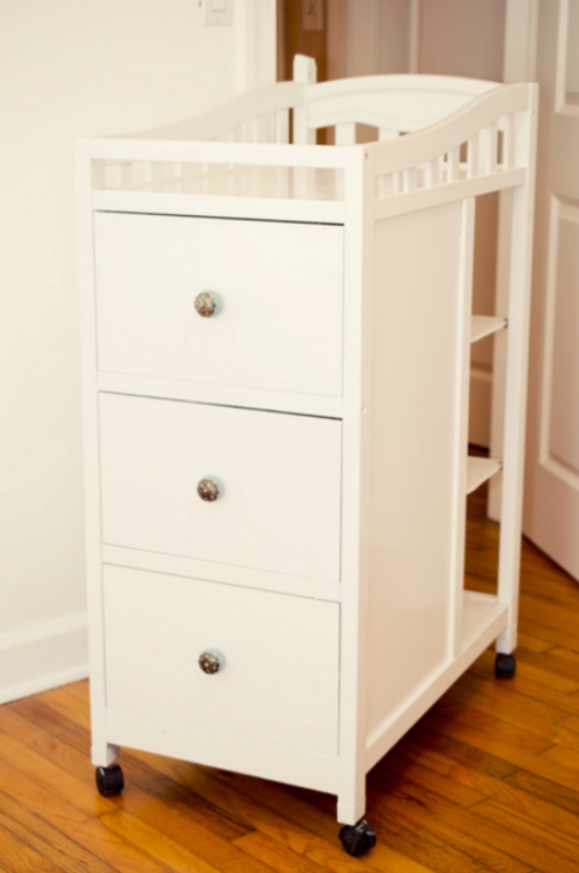 White Changing Table Dresser, Open Side Shelves, Decorative Knobs, Casters