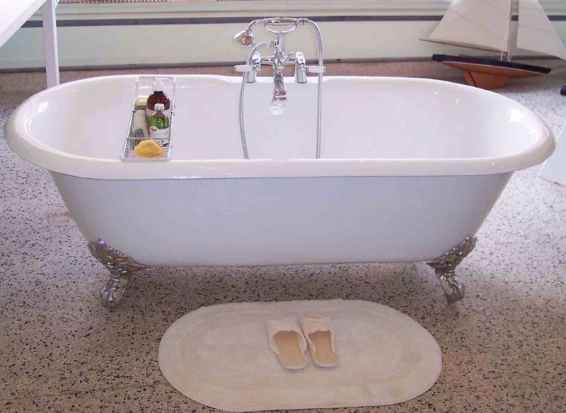 White Clawfoot Bathtub with Deck-Mounted Polished Chrome Bridge Faucet