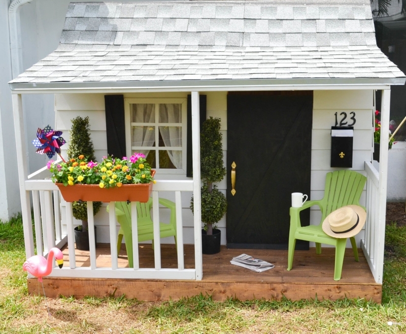 White Farmhouse Playhouse with Front Porch & Black Shutters
