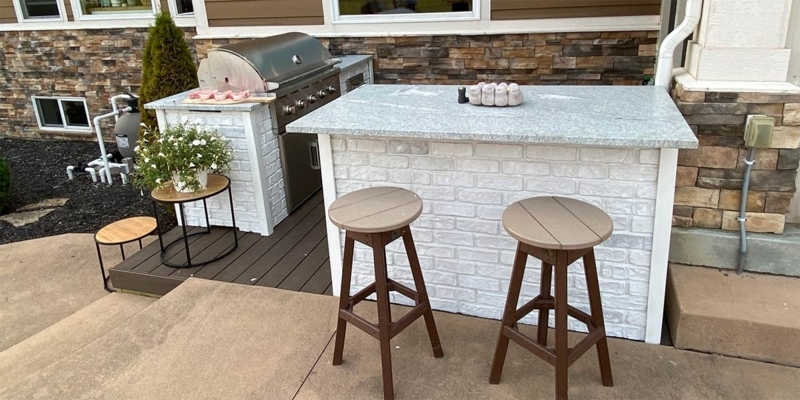 Whitewashed Brick Outdoor Bar Island with Slat Top Stools