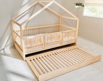 Woodland Style House Bed featuring Leaf Cutout Railings and Trundle.