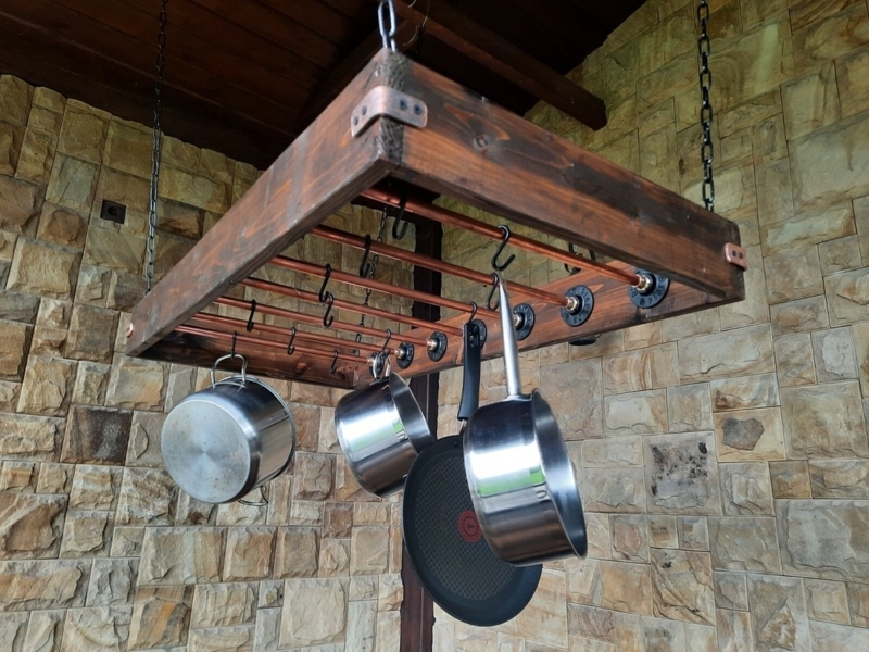 Hanging Pot Rack: Dark Wood Frame with Copper Pipe Details.