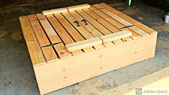 Rustic Slatted Wood Sandbox with Black Strap Hinges and Folding Bench