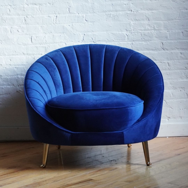 Accent Chair featuring a Seashell Back and Gold Tapered Legs