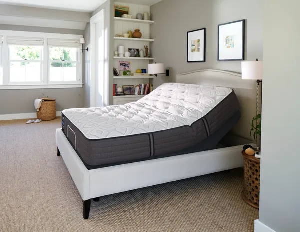 Adjustable Bed with Arched Headboard and Geometric Quilted Mattress