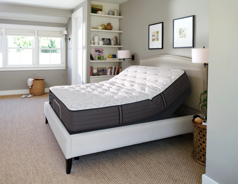 Adjustable Bed with Arched Nailhead Headboard and Quilted Top