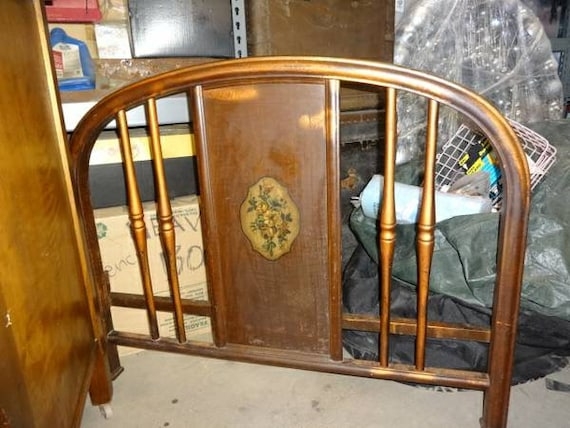 Antique Metal Footboard with Faux Bois Finish and Floral Medallion.