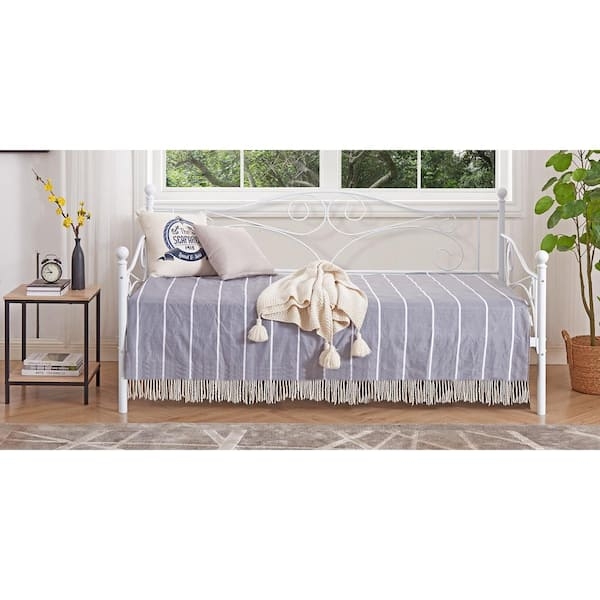 Arched Scrolled Metal Daybed styled with Striped Bedding