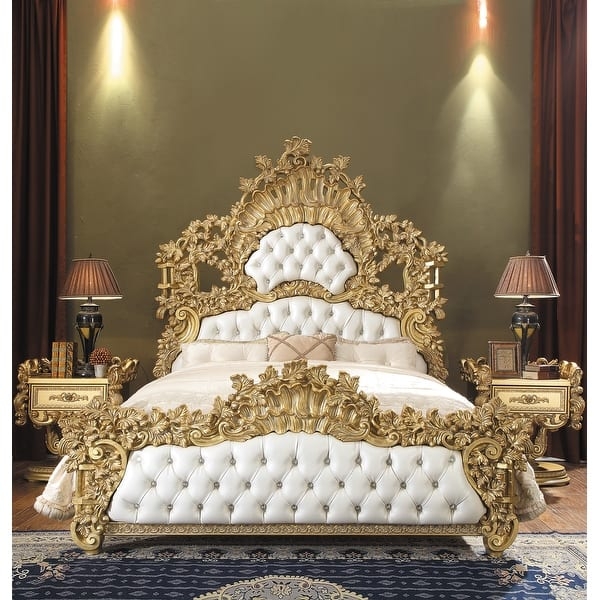 Bed Featuring Scrolled Floral Headboard and White Tufted Upholstery