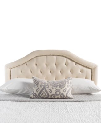 Beige Upholstered Arched Headboard with Winged Sides and Nailhead Trim