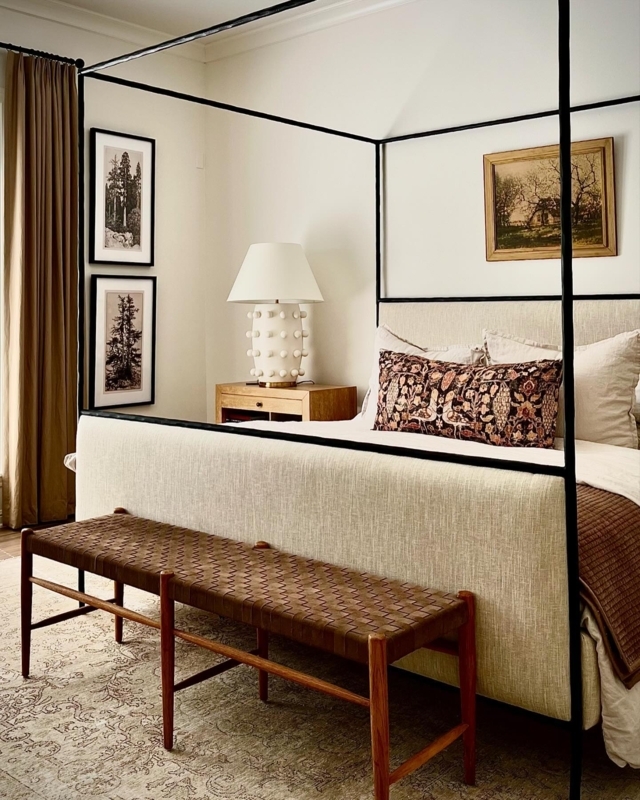 Black Steel Canopy Bed with Slender Frame and Cream Upholstery