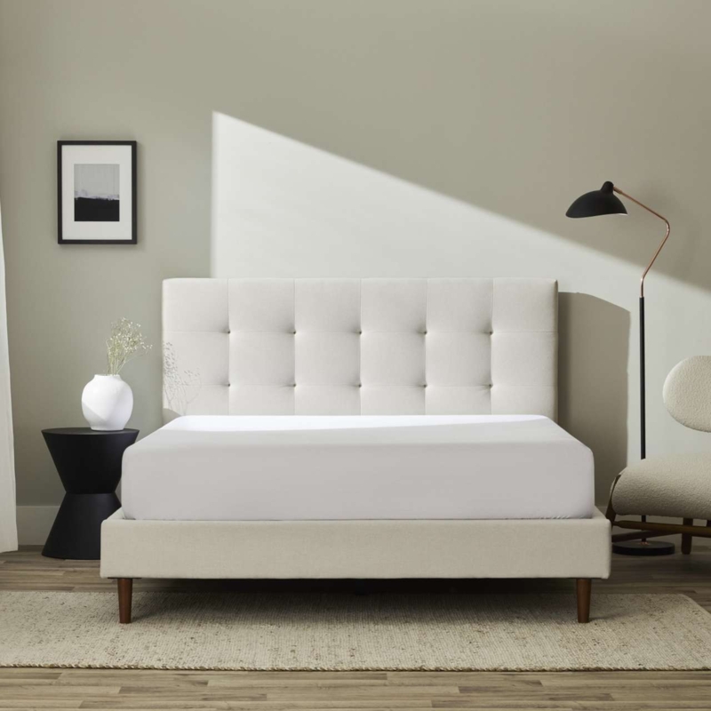 Cream Upholstered Bed with Rounded Headboard and Tapered Legs