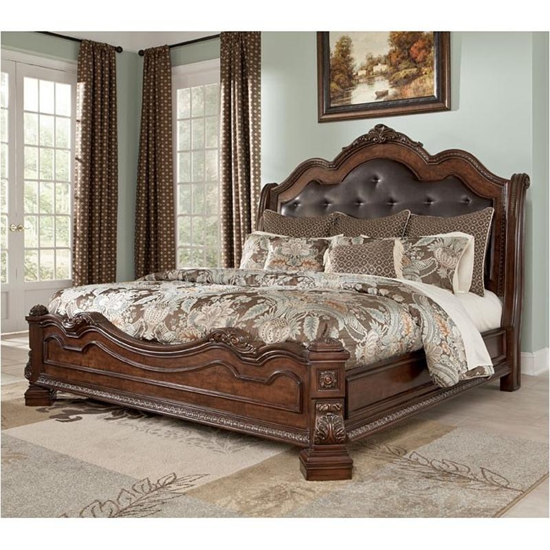 Grand Sleigh Bed in Rich Espresso with Ornate Scroll Carvings and Tufting
