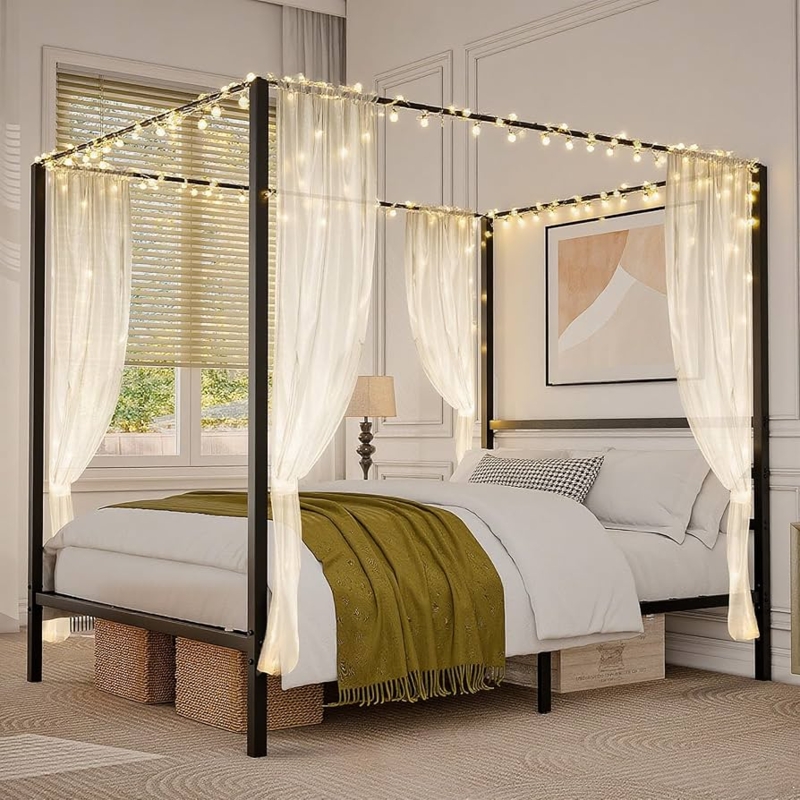 Matte Black Canopy Bed Frame Draped with Warm String Lights