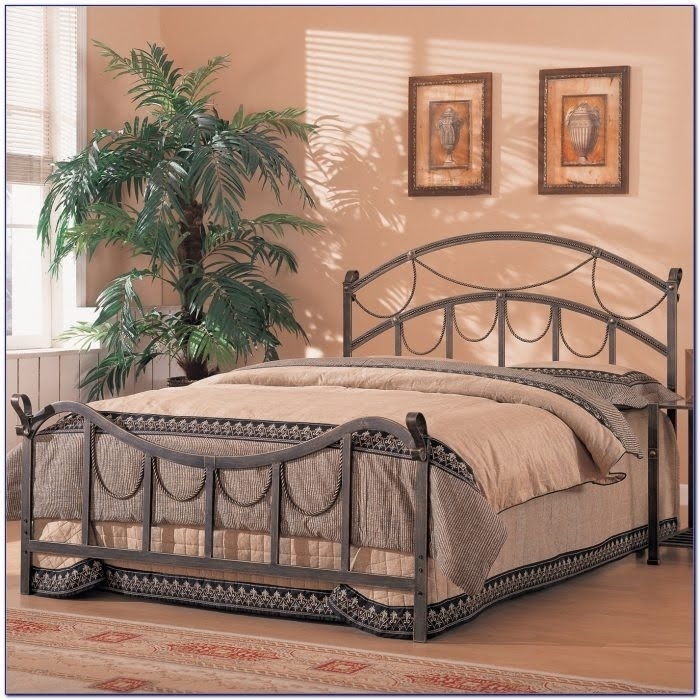 Metal Bed with Ornate Swag Detail and Arched Silhouette