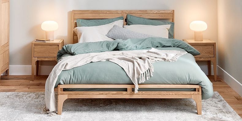 Minimalist Bed Frame in Light Oak Finish with Slatted Headboard.