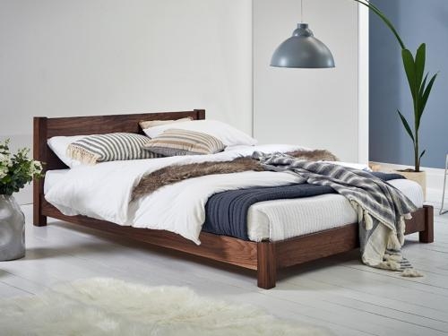 Minimalist Low Profile Platform Bed in Dark Wood Tone.