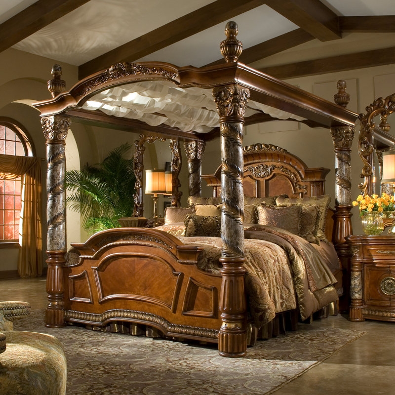 Ornate Canopy Bed with Spiral Stone-Like Posts and Carved Wood