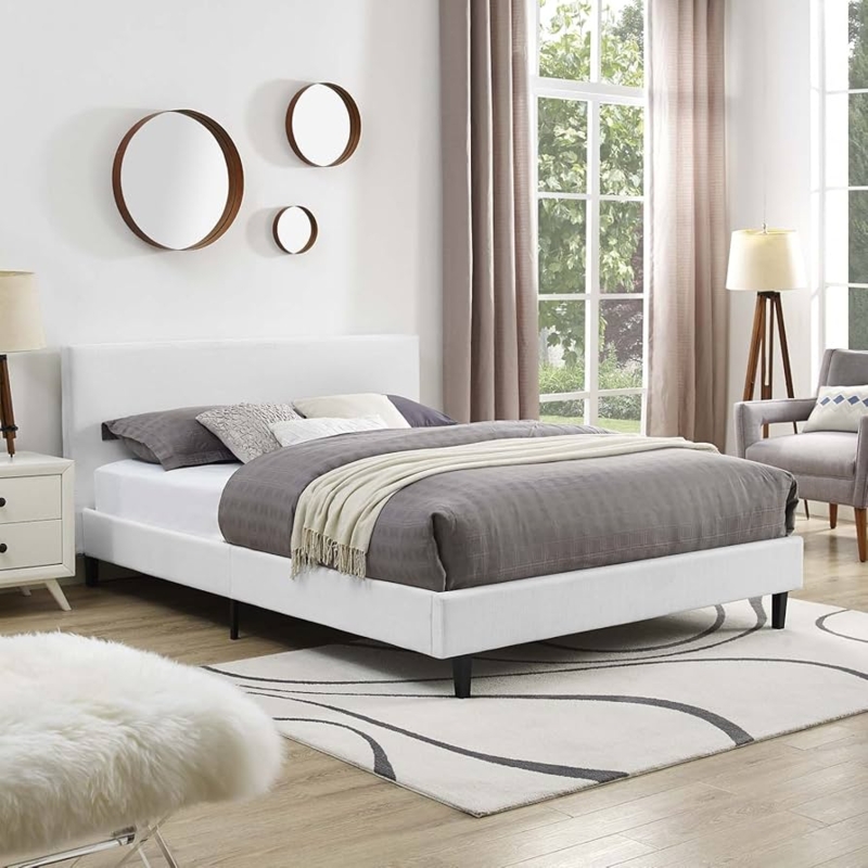 Platform Bed Upholstered in White Fabric with Tapered Black Legs