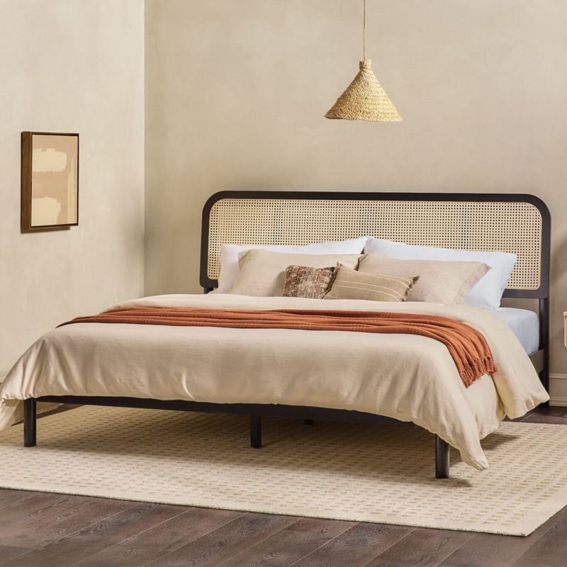Platform Bed with Curved Rattan Headboard and Woven Cane Panel.