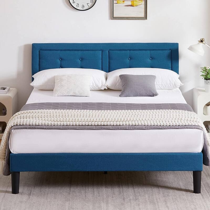 Platform Bed with Navy Blue Upholstery and Button-Tufted Headboard