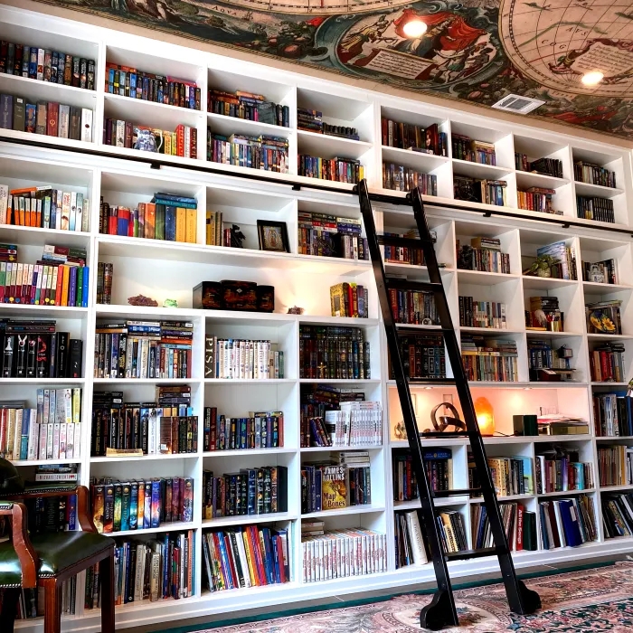 Scholarly White Built-In Bookcase with Black Rolling Ladder System
