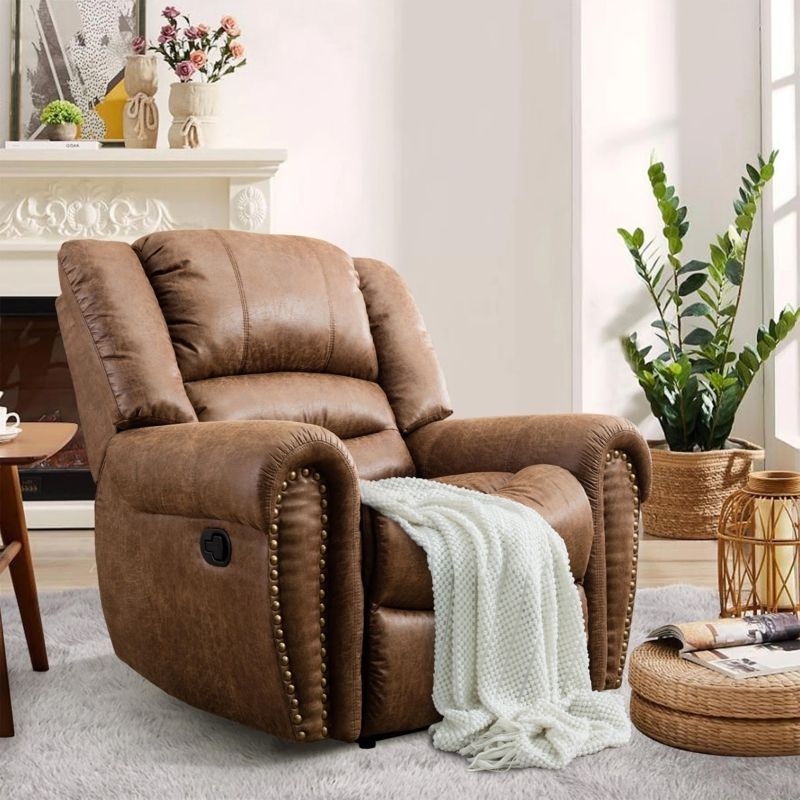 Traditional Manual Recliner with Oversized Padding and Bronze Rivets