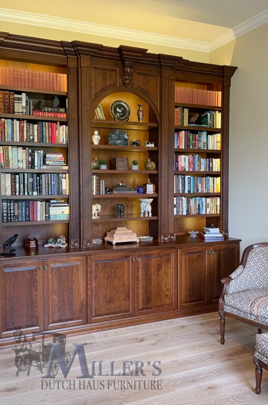 Traditional Wood Bookcase with Arched Alcove and Integrated Lighting