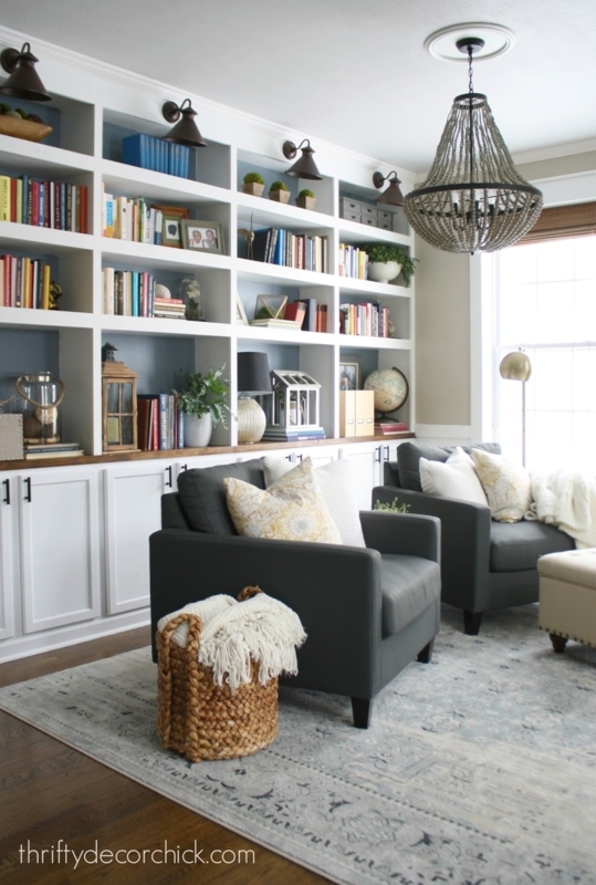Transitional White Built-In Bookcase featuring Navy Blue Shelf Backs