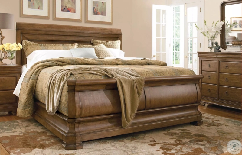 Warm Brown Sleigh Bedroom Set featuring Classic Curves and Botanical Rug