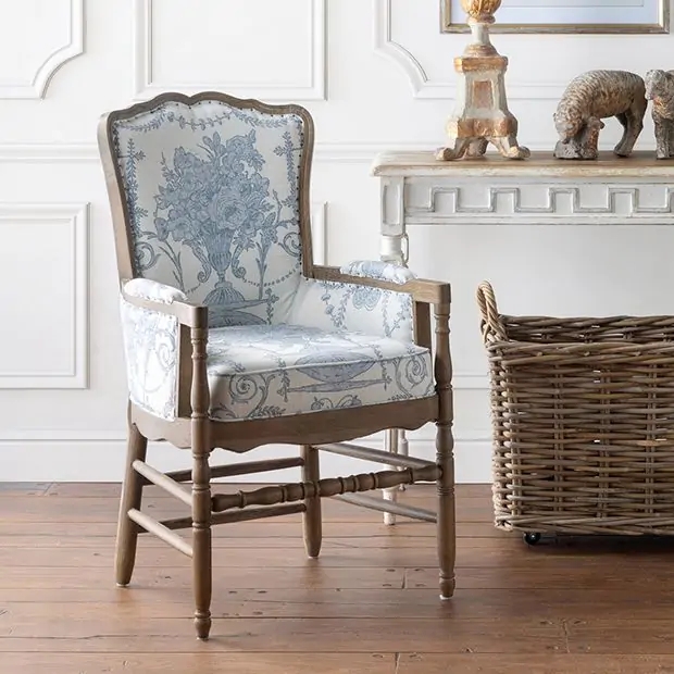 Wingback Accent Chair featuring Distressed Carved Wood and Tufting