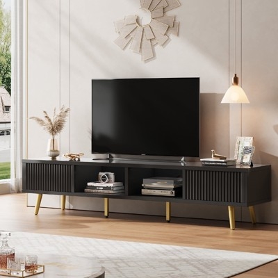 Black TV Stand with Gold Tapered Legs and Ribbed Sliding Doors