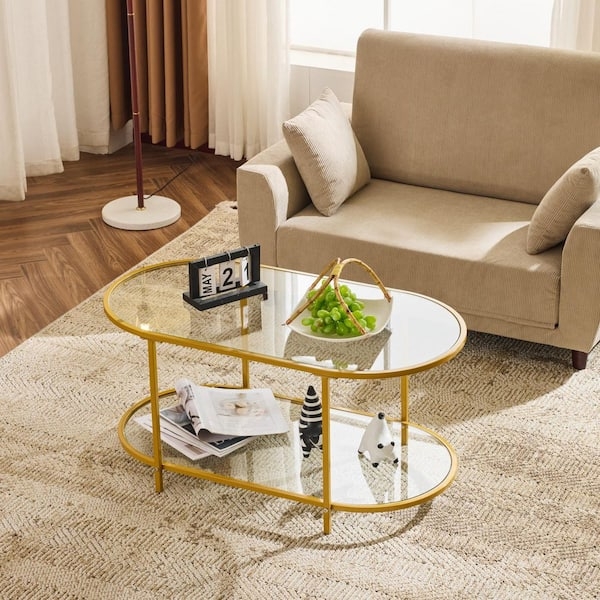 Coffee Table with Oval Glass Tiers and Polished Gold Finish Frame
