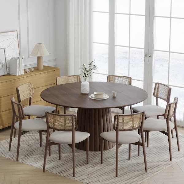 Dark Walnut Round Dining Table with Ribbed Pedestal Base and Cane Chairs