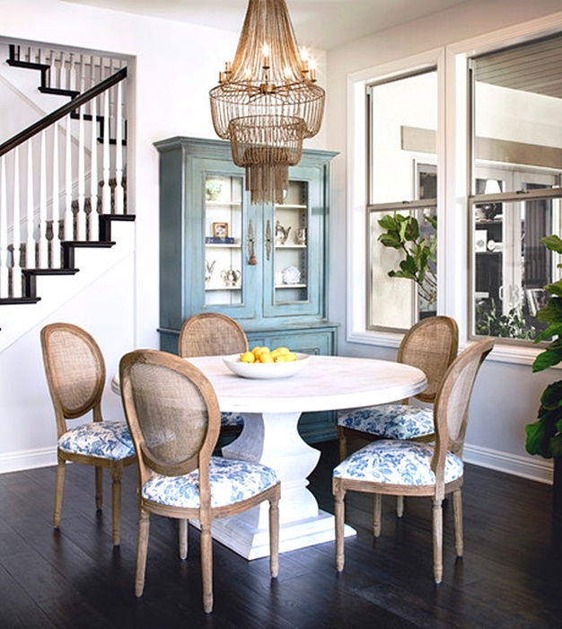 Dining Set featuring Cane Back Chairs and a White Pedestal Table