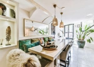Dining Table: Stone Top, Woven Shade Pendants, Banquette Seating