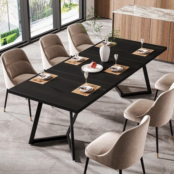 Dining Table with Angular Metal Legs and Beige Barrel-Back Chairs