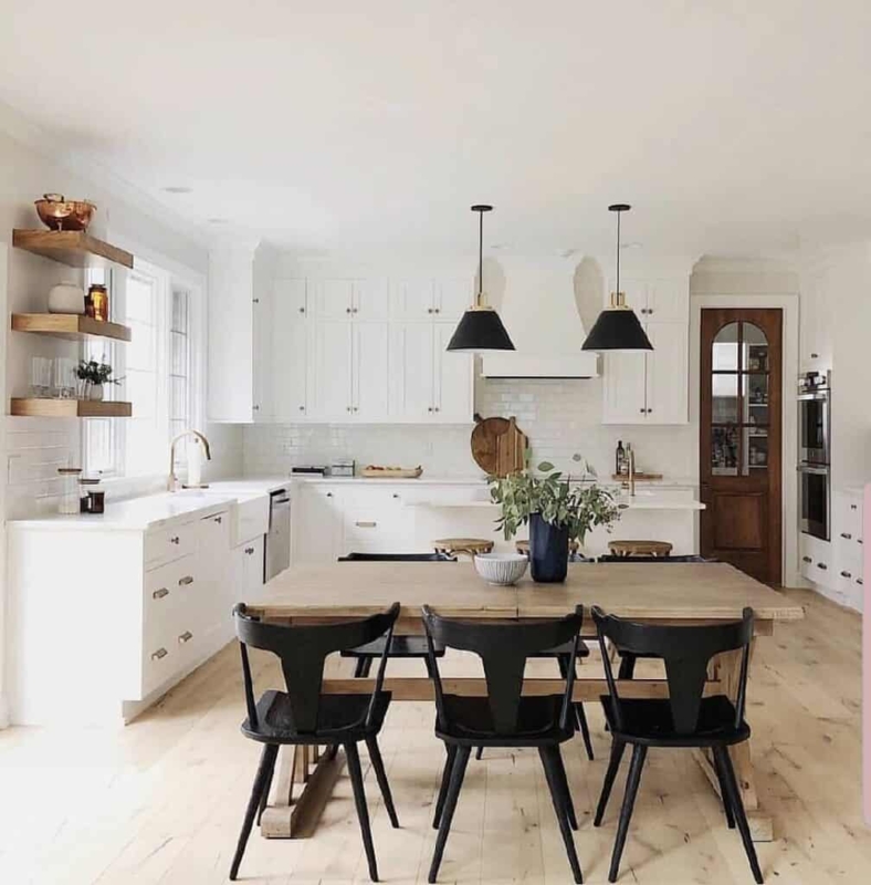 Farmhouse Kitchen featuring Arched Pantry Door and Open Shelving
