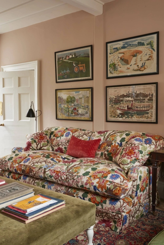 Floral Upholstered Sofa with Skirted Base against Dusty Pink Walls