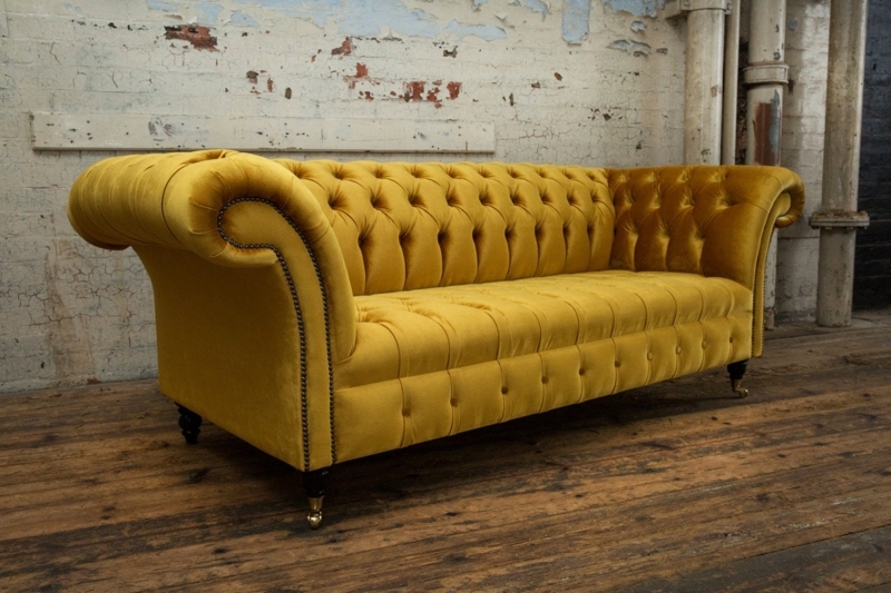 Gold Tone Chesterfield Sofa with Deep Button Tufting and Caster Feet