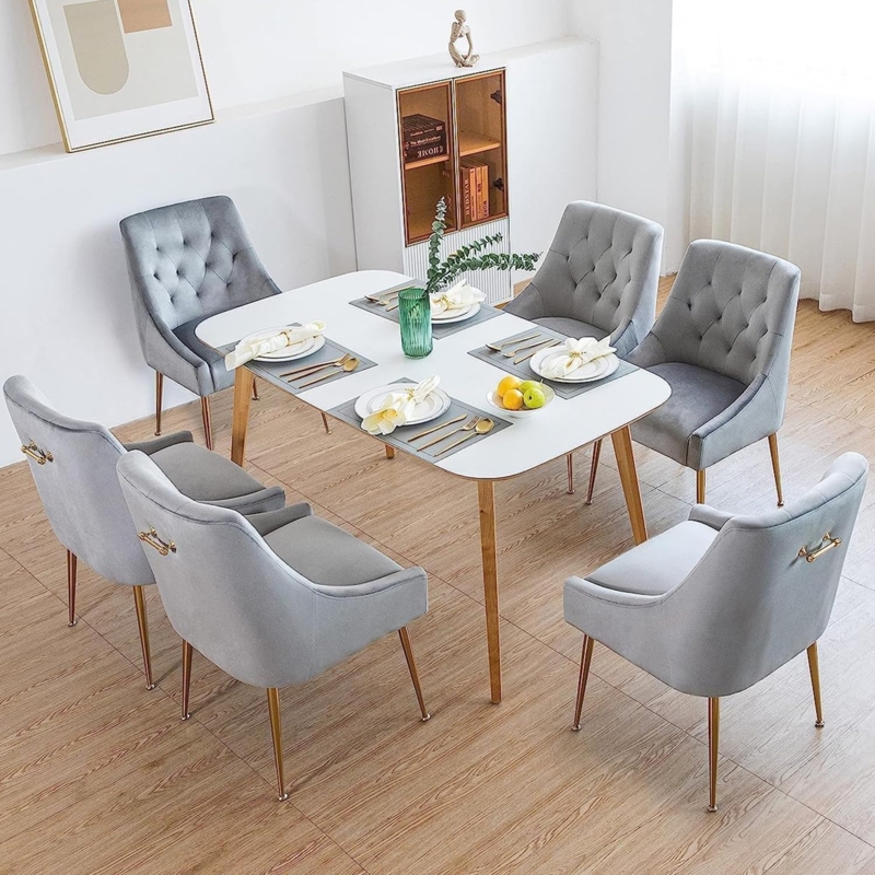 Grey Velvet Tufted Dining Chairs with Gold Legs and Back Pulls