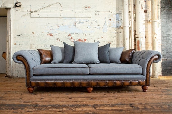 Herringbone Sofa featuring Leather-Like Trim and Industrial Scatter Back