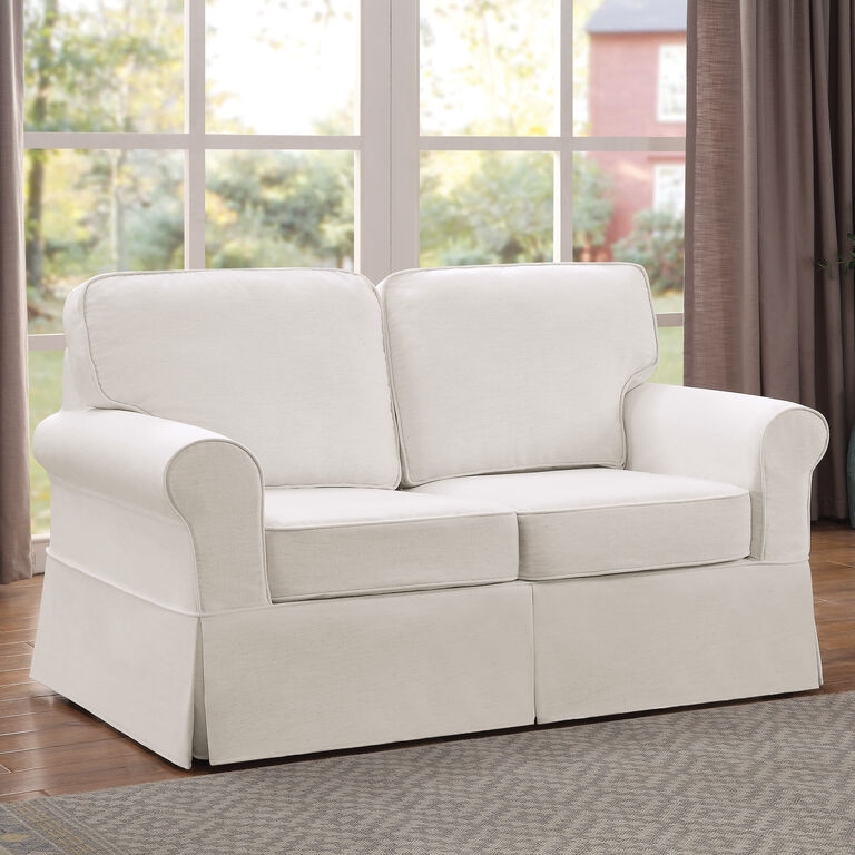 Ivory Slipcover Loveseat with Piped Edges and Traditional Rolled Arms