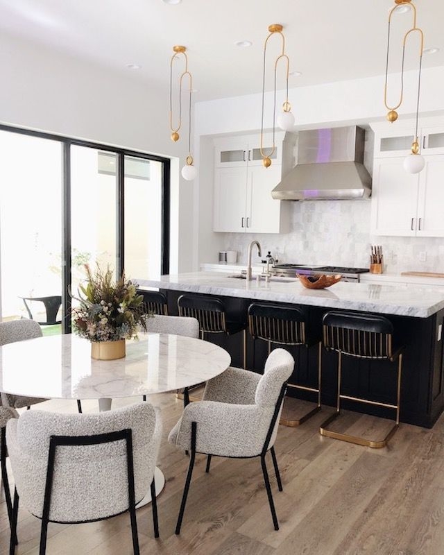 Kitchen Island with Gold Globe Pendants and Boucle Chairs