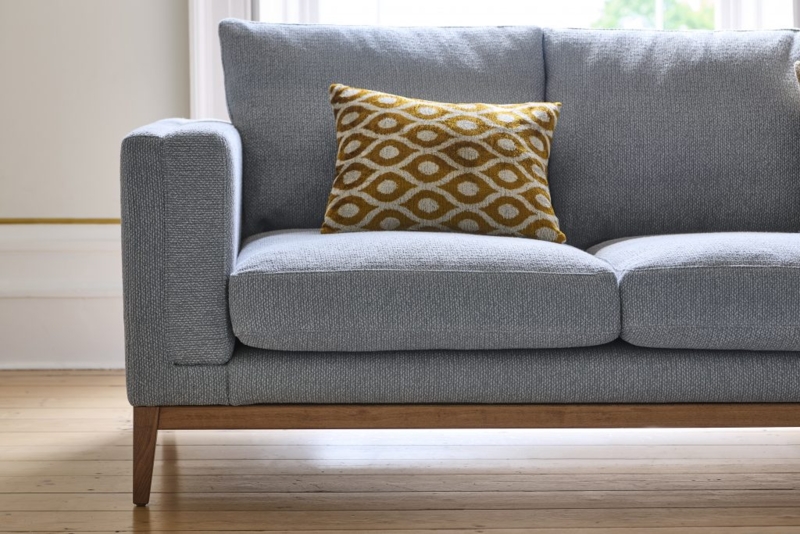 Light Blue Woven Sofa with Exposed Wood Base and Tapered Legs